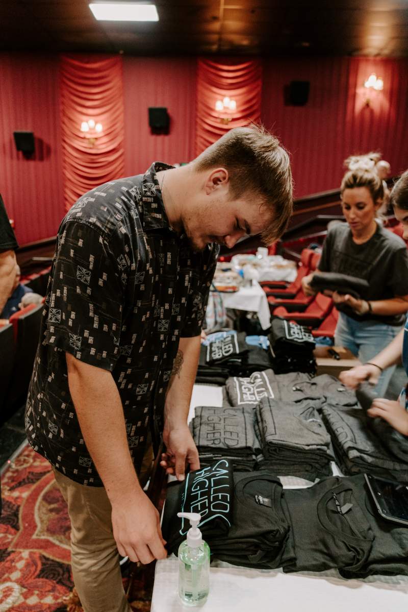 Christian and Bethany at the t-shirt table