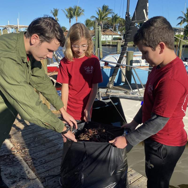 The Called Higher Team cleans up trash and debris at the dock