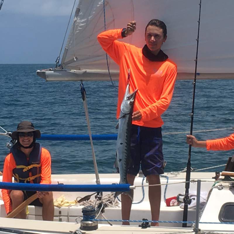 Jacob and Sean catch a kingfish while sailing along the Florida coastline